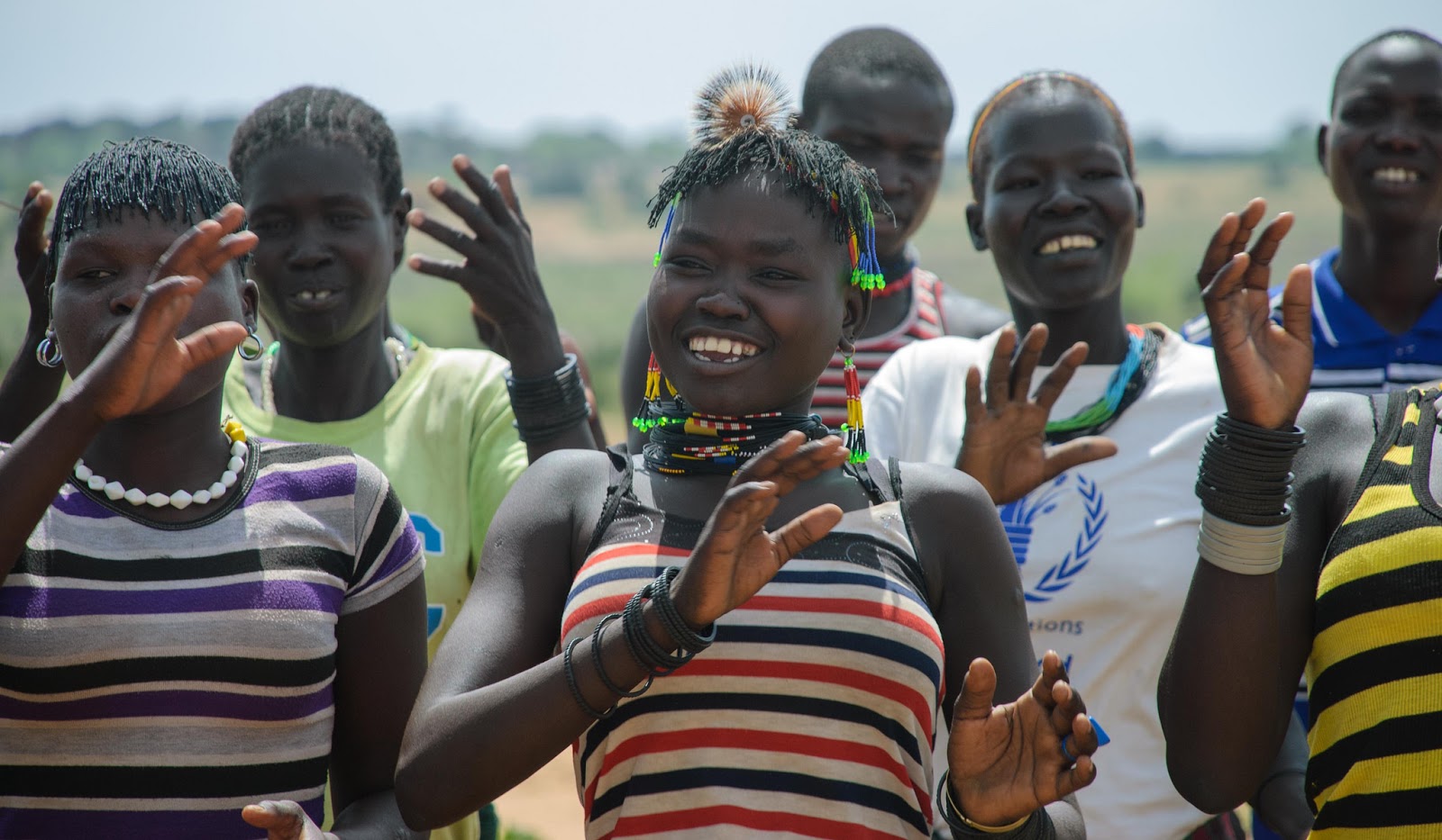 Picture of cheerful young women doing some group activities; photo provided by RestLess Development