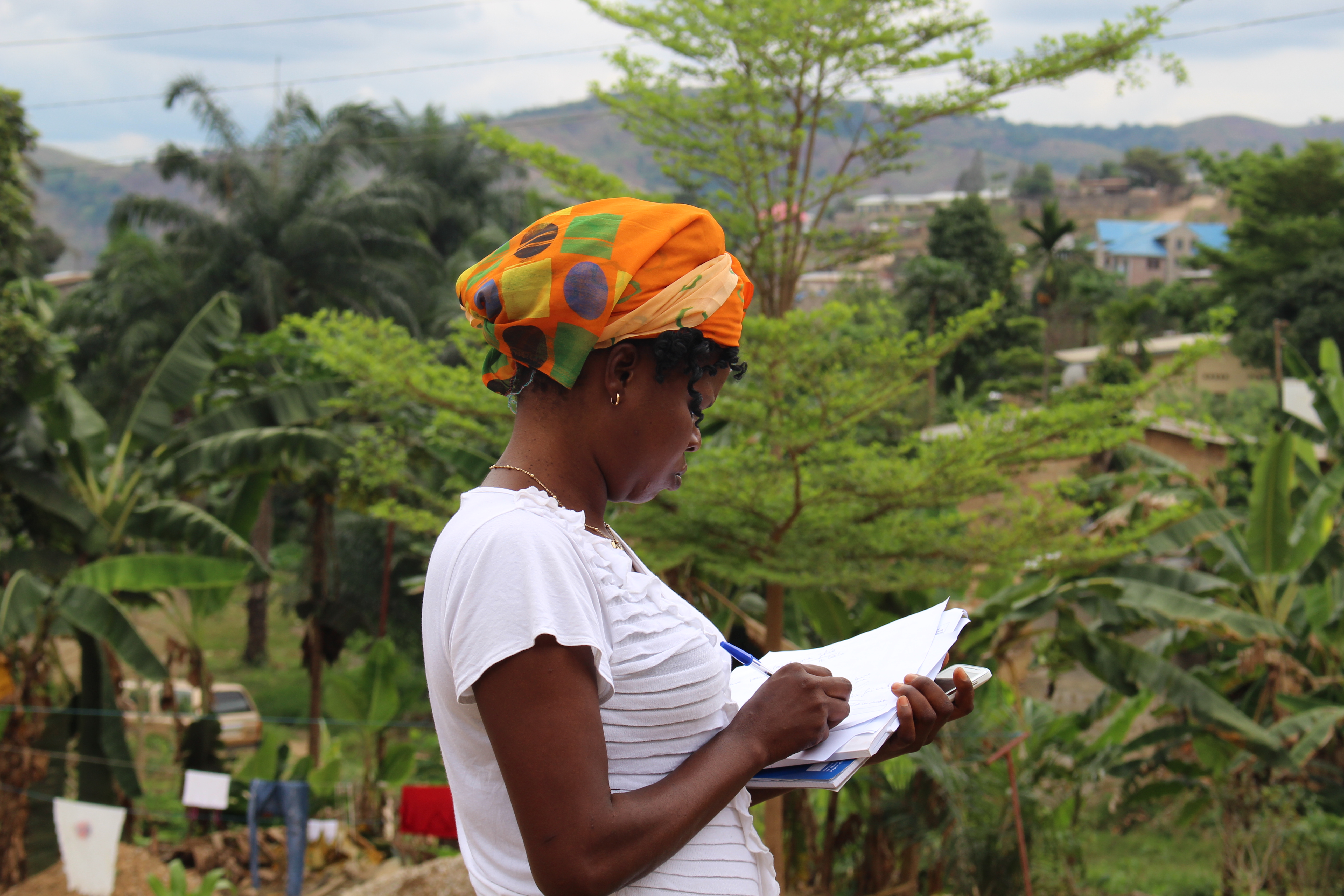 A resident enumerator in Congo (Kinshasa), prepares for another round of data collection for PMA2020, a mobile technology-based survey project that supports routine, rapid-turnaround, high quality data on family planning and other health indicators. © 2015 PMA2020/Shani Turke, Courtesy of Photoshare