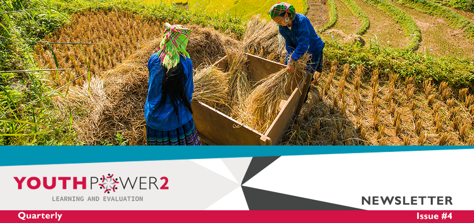 Two women working in argriculture out in a field gathering crops.